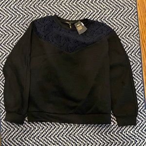NWT Maje sweatshirt. Black with floral pattern at neck.